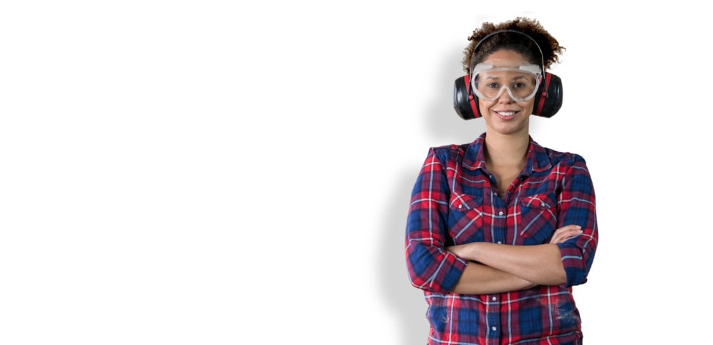 smiling woman wearing ear and eye protection